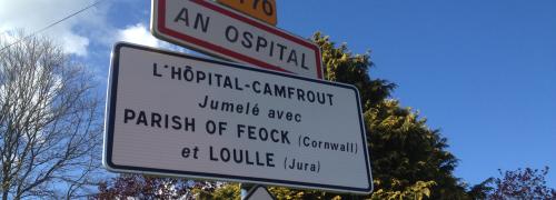 Sign indicating the name of a village in French and Breton