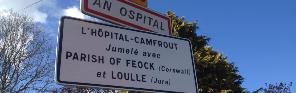 Sign indicating the name of a village in French and Breton